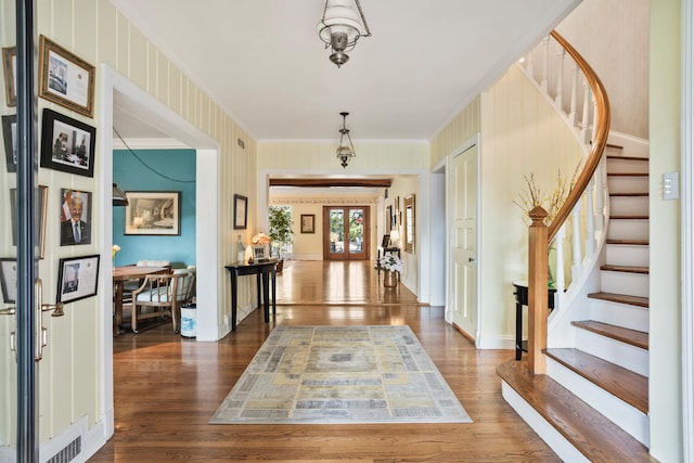 27 Hickory Ln, White Heath, IL 61884 - foyer featuring dark wood-type flooring, crown molding, and stairway