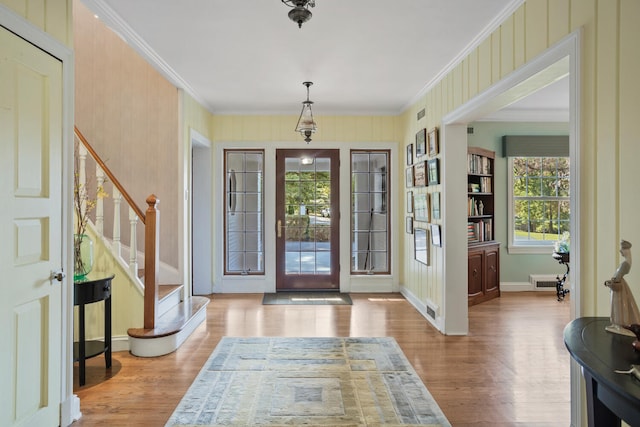 27 Hickory Ln, White Heath, IL 61884 - entrance foyer featuring crown molding, wood finished floors, and stairway