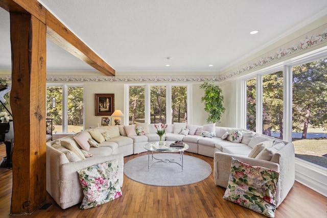 27 Hickory Ln, White Heath, IL 61884 - living room with wood finished floors, ornamental molding, and beam ceiling