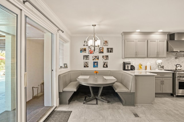 27 Hickory Ln, White Heath, IL 61884 - dining space featuring breakfast area, a chandelier, and crown molding
