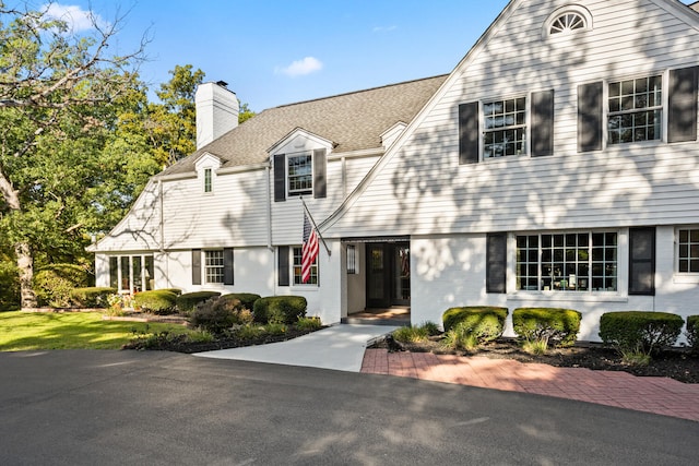 27 Hickory Ln, White Heath, IL 61884 - view of front of property with a chimney and brick siding