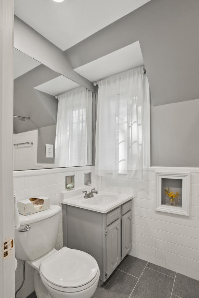 27 Hickory Ln, White Heath, IL 61884 - half bath featuring tile walls, vanity, and tile patterned flooring