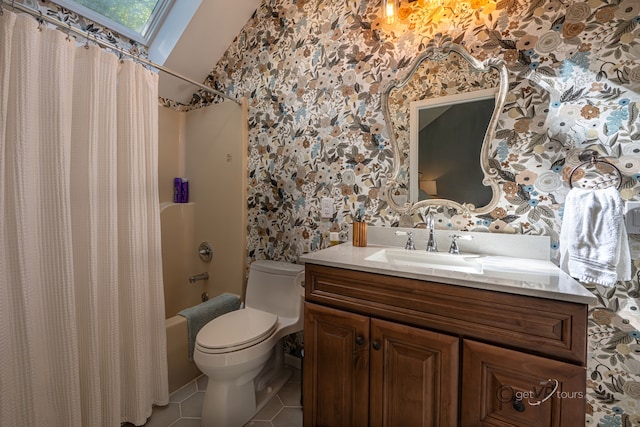 full bathroom with vanity, shower / bath combo with shower curtain, toilet, and tile patterned flooring