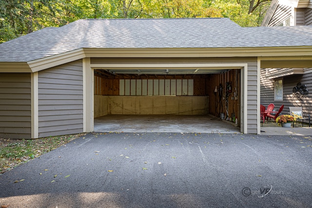 garage featuring wood walls