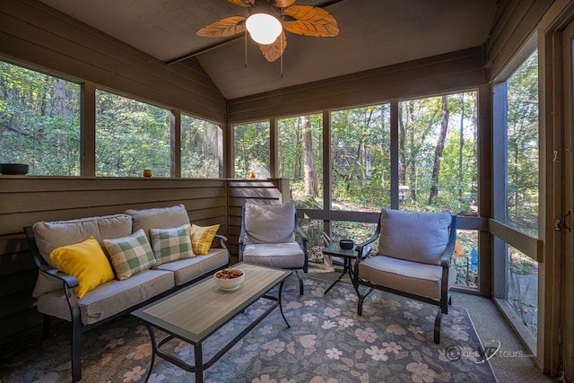 sunroom featuring vaulted ceiling and ceiling fan