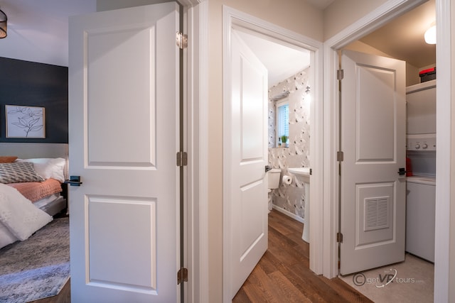 hallway with dark hardwood / wood-style flooring