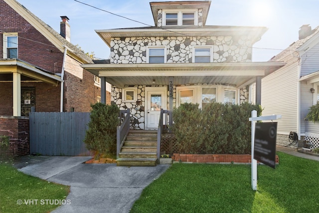 view of front of property with a front lawn and a porch