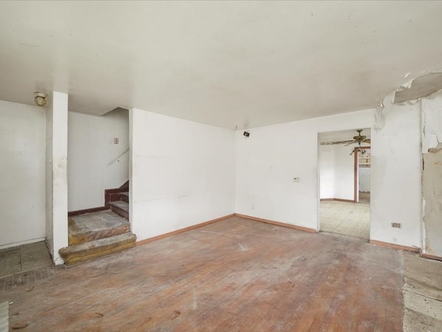 empty room featuring wood-type flooring and ceiling fan