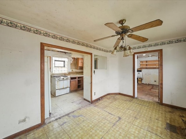 unfurnished room with crown molding and ceiling fan