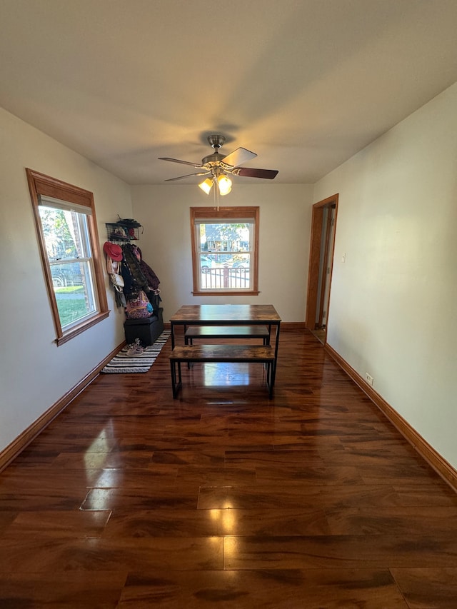 dining area featuring dark wood-type flooring, a wealth of natural light, and ceiling fan