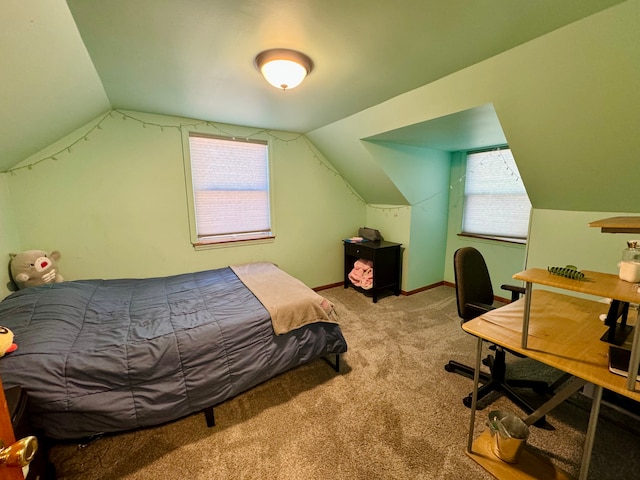 bedroom with carpet flooring, vaulted ceiling, and multiple windows