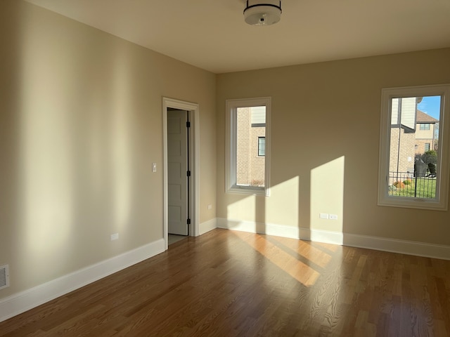 empty room featuring dark hardwood / wood-style floors