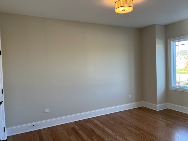 empty room featuring dark wood-type flooring