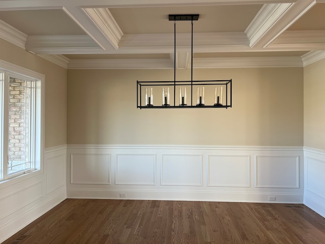 unfurnished dining area featuring dark wood-type flooring and ornamental molding