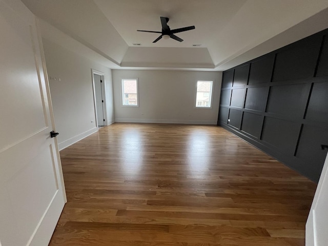 8673 High Stone Way, Frankfort, IL 60423 - unfurnished room featuring plenty of natural light, a ceiling fan, wood finished floors, and a tray ceiling