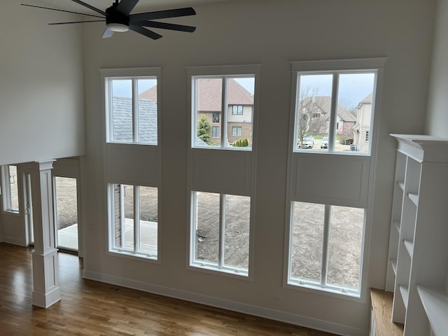 8673 High Stone Way, Frankfort, IL 60423 - unfurnished living room featuring baseboards, a ceiling fan, wood finished floors, and a fireplace