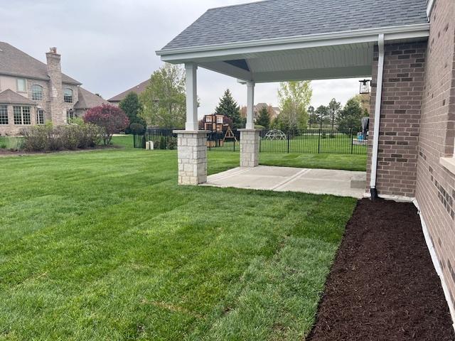 8673 High Stone Way, Frankfort, IL 60423 - back of house with brick siding and a garage