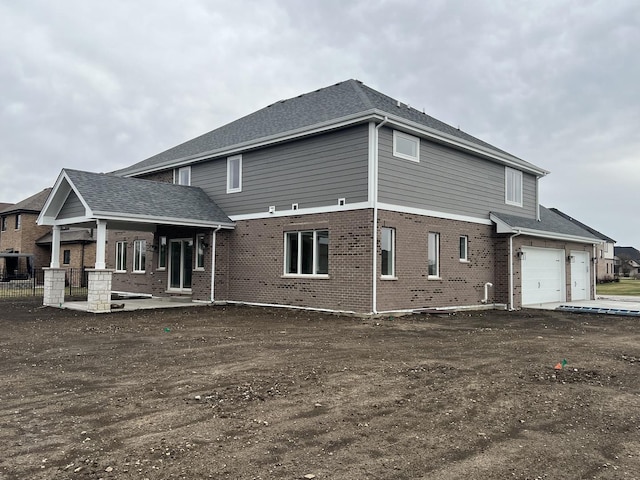 8673 High Stone Way, Frankfort, IL 60423 - back of house with brick siding and a garage