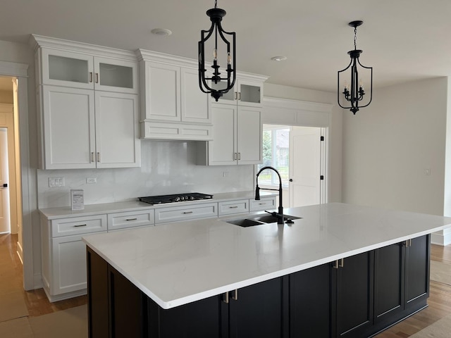 8673 High Stone Way, Frankfort, IL 60423 - kitchen with a sink, light countertops, white cabinets, dark cabinets, and stainless steel appliances