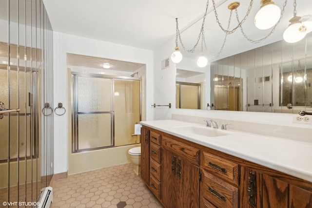 full bathroom with vanity, tile patterned floors, toilet, enclosed tub / shower combo, and a baseboard radiator