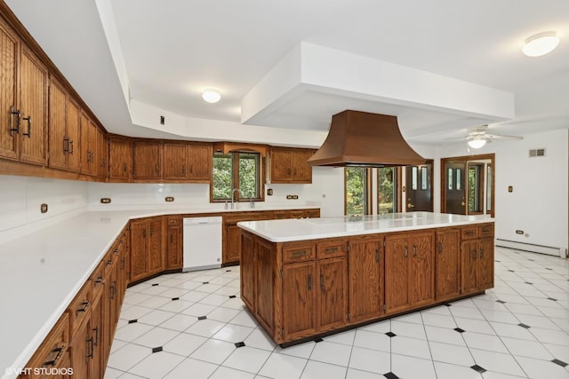 kitchen with white dishwasher, plenty of natural light, premium range hood, and ceiling fan