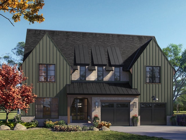 view of front of home featuring a front yard and a garage