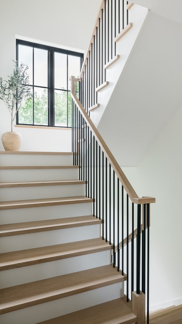 stairs with hardwood / wood-style floors