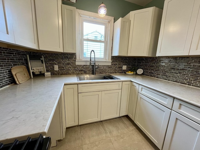 kitchen with decorative backsplash and sink