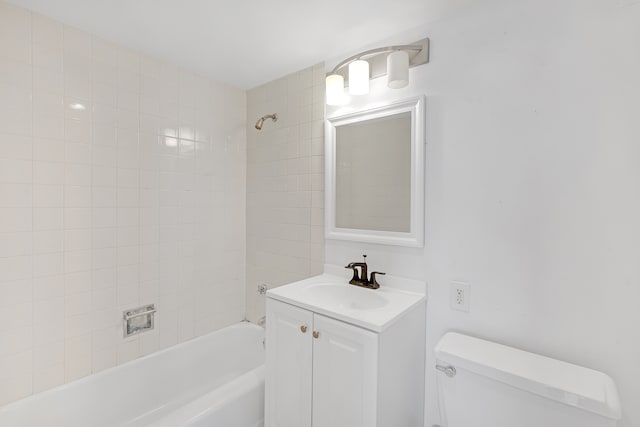 full bathroom with vanity, toilet, and tiled shower / bath