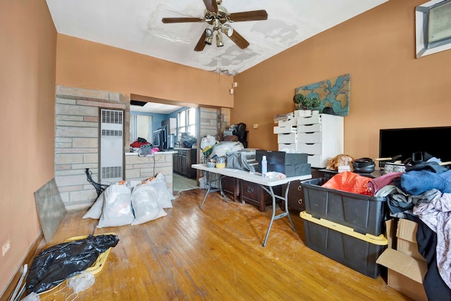 interior space with hardwood / wood-style floors and ceiling fan