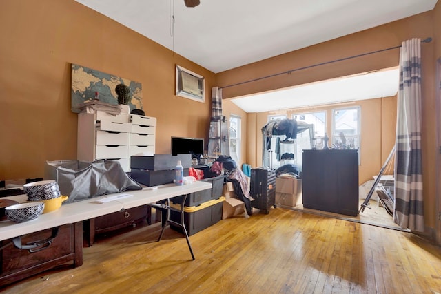 misc room featuring a wall unit AC and light hardwood / wood-style floors