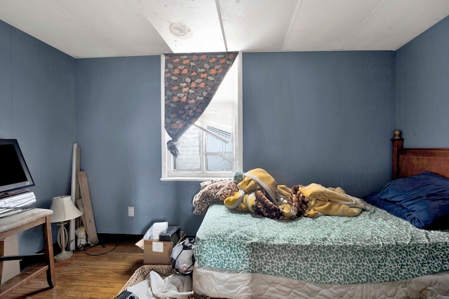 bedroom featuring wood-type flooring