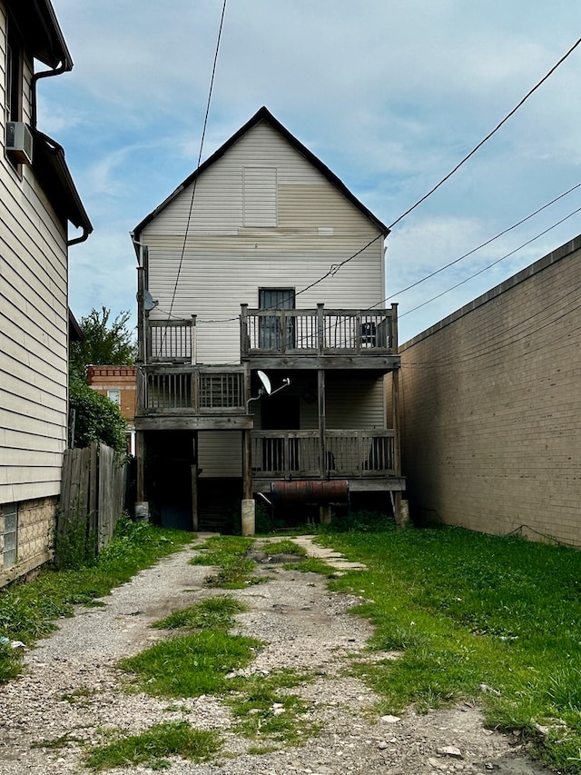 back of property with a wooden deck