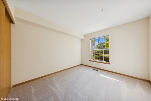 unfurnished room with carpet