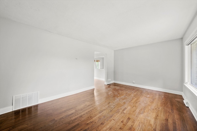 unfurnished room featuring hardwood / wood-style flooring