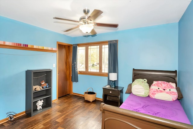 bedroom featuring dark wood-type flooring and ceiling fan