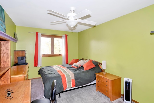 bedroom with ceiling fan and light colored carpet