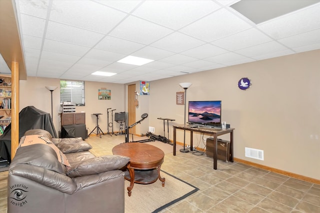 tiled living room with a drop ceiling