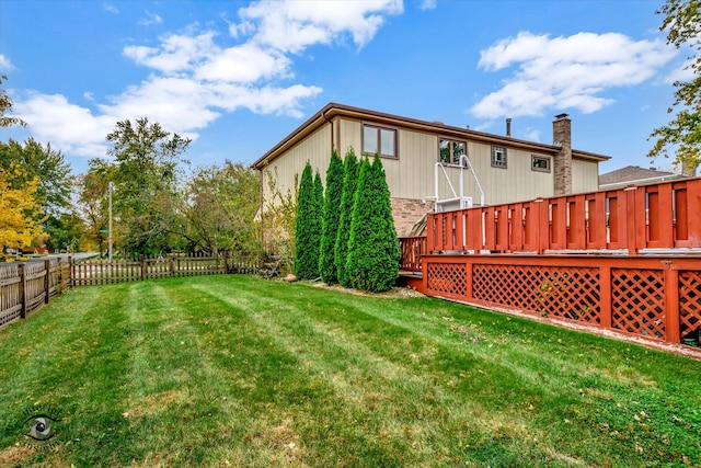 view of yard featuring a wooden deck