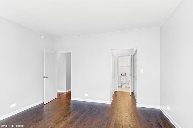 spare room featuring dark hardwood / wood-style flooring