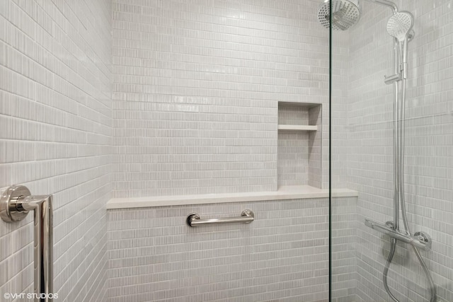 bathroom with a tile shower