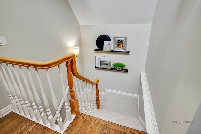 stairs with lofted ceiling