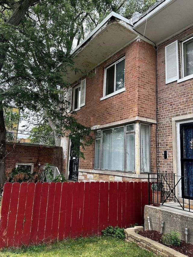 8338 S Ingleside Ave, Chicago, IL 60619 - view of front of house with brick siding and fence
