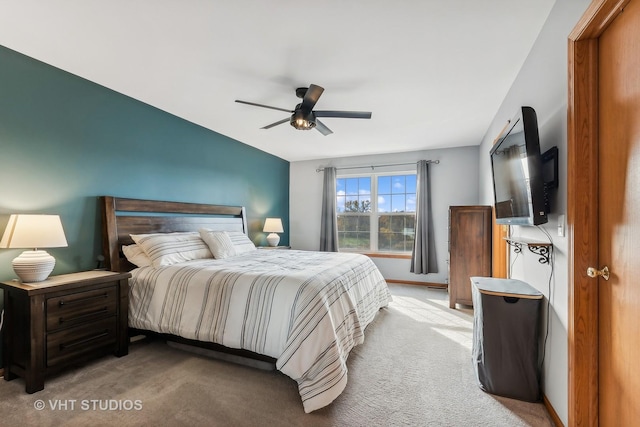 bedroom with ceiling fan and light carpet