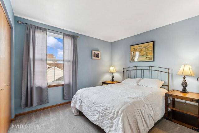 carpeted bedroom with a closet