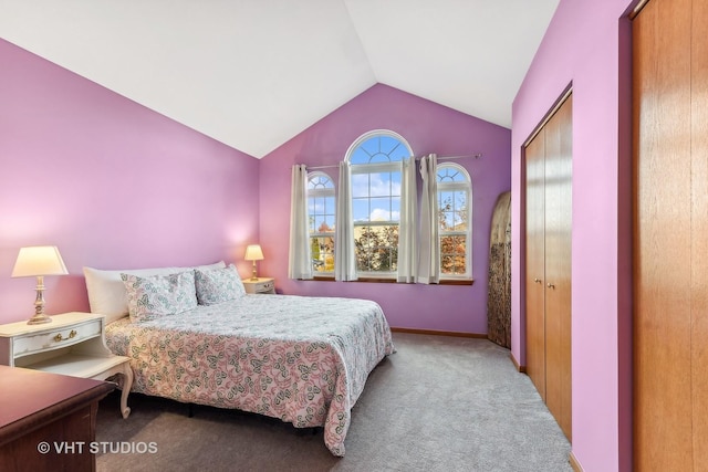 bedroom with light carpet, a closet, and lofted ceiling