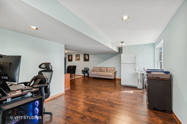 home office with dark wood-type flooring