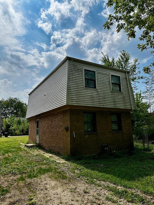 355 W 105th Pl, Chicago, IL 60628 - view of side of home featuring brick siding and a yard