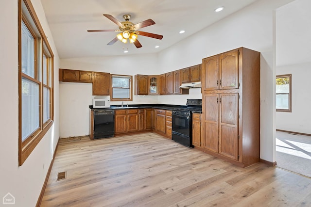 kitchen with light hardwood / wood-style flooring, black appliances, sink, and ceiling fan