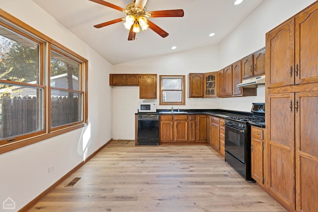 kitchen with black appliances, sink, light hardwood / wood-style floors, ceiling fan, and lofted ceiling